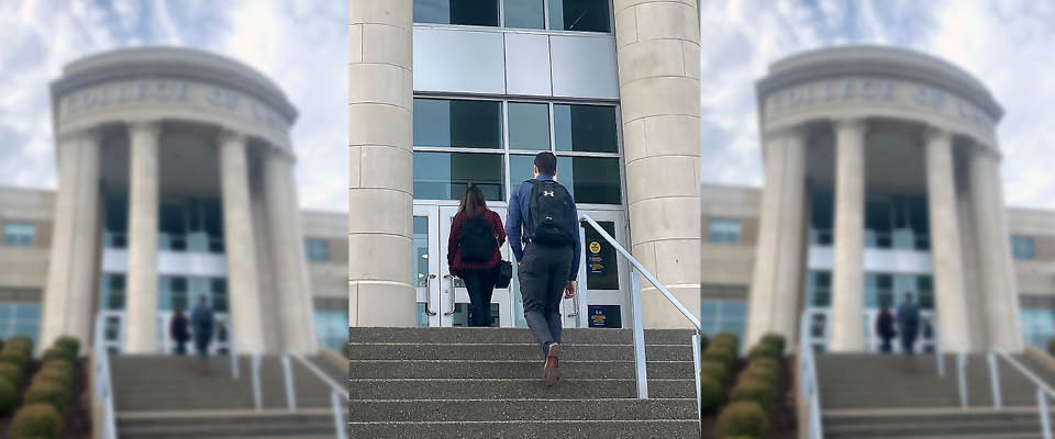 WVU Law student Shawn Hogbin walking into the law school